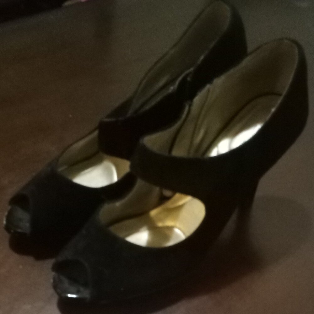 A pair of Black "Bandolino" heels with a gold zipper(size 10W)